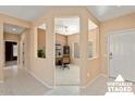 Virtually staged home office with built-in shelving and window at 15920 W Summerwalk Dr, Surprise, AZ 85374