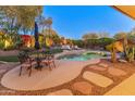 Inviting pool with ample patio space for lounging and entertaining at 1646 W Ainsworth Dr, Anthem, AZ 85086