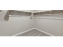 Large walk-in closet with double hanging rods at 21011 N 58Th Way, Phoenix, AZ 85054