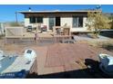 Large backyard deck with hot tub and brick patio at 211 W Kiser St, Superior, AZ 85173