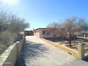 Home exterior with driveway and landscaping at 211 W Kiser St, Superior, AZ 85173