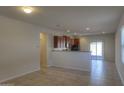 Open floor plan connecting dining area, kitchen, and living room at 22424 W La Pasada Blvd, Buckeye, AZ 85326