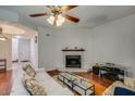 Cozy living room featuring a fireplace and hardwood floors at 2315 W Union Hills Dr # 112, Phoenix, AZ 85027