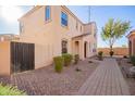 Two-story house with a brick walkway and a gate at 2613 E Bart St, Gilbert, AZ 85295