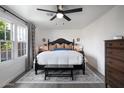 Spacious primary bedroom with a king-size bed and backyard view at 2649 N Granite Reef Rd, Scottsdale, AZ 85257