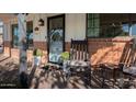 Relaxing front porch with rocking chairs and brick flooring at 2649 N Granite Reef Rd, Scottsdale, AZ 85257