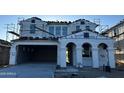 Two-story home under construction featuring a garage and a front porch with columns at 27264 N 74Th Ln, Peoria, AZ 85383