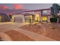 Two-story house with landscaped yard and three-car garage at 2921 S Martingale Rd, Gilbert, AZ 85295