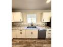 Modern kitchen featuring double sink and granite countertops at 34902 W Caldwell St, Tonopah, AZ 85354