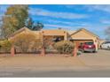 House with a red SUV parked in the driveway at 3848 W Morrow Dr, Glendale, AZ 85308