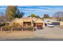 Single-story home with a two-car garage and landscaped yard at 3848 W Morrow Dr, Glendale, AZ 85308