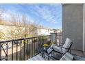 Relaxing balcony with seating offers a private outdoor space to enjoy views of the neighborhood at 4058 E Erie E St # 103, Gilbert, AZ 85295