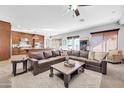 Open living area with sectional sofa and large windows at 4113 E Burnside Trl, Cave Creek, AZ 85331