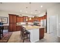 Kitchen boasts granite countertops and ample cabinetry at 42028 N Crooked Stick Rd, Anthem, AZ 85086