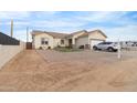 House with a large front yard, driveway, and two-car garage at 5830 E Fox Hollow Ln, San Tan Valley, AZ 85140