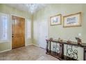 Bright and airy entryway with tile flooring and a stylish console table at 6830 S Crystal Way, Chandler, AZ 85249