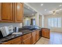 Modern kitchen with granite countertops and stainless steel appliances at 6830 S Crystal Way, Chandler, AZ 85249