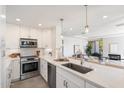 Modern kitchen with white cabinets and stainless steel appliances at 7760 E Gainey Ranch Rd # 30, Scottsdale, AZ 85258