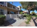 Spacious patio with table and chairs adjacent to the home at 7800 E Lincoln Dr # 1029, Scottsdale, AZ 85250