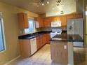 Traditional kitchen with granite countertops, island, and ample cabinet space at 10238 E Blanche Dr, Scottsdale, AZ 85255