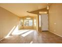 Bright living room with large windows, neutral colors, and tile floors at 10238 E Blanche Dr, Scottsdale, AZ 85255