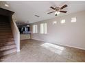 Spacious living room with tile floors and a view of the kitchen at 10332 W Devonshire Ave, Phoenix, AZ 85037