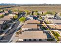 Aerial view of house with pool and surrounding desert landscape at 10808 W Cottontail Ln, Peoria, AZ 85383