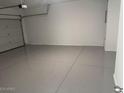 Spacious garage with a gray epoxy floor, room for two cars and extra storage at 1413 W Hess Ave, Coolidge, AZ 85128