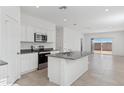 Modern kitchen with stainless steel appliances and island at 1413 W Hess Ave, Coolidge, AZ 85128