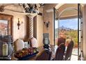 Elegant dining room with mountain views and a large wooden table at 16117 E Shooting Star Trl, Fountain Hills, AZ 85268