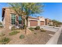 View of multiple homes in a community setting, showing similar architectural styles at 16884 W Pinchot Ave, Goodyear, AZ 85395