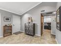 Entryway with tile flooring and decorative storage cabinet at 18026 N 136Th Way, Sun City West, AZ 85375