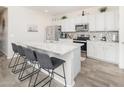 Modern kitchen with granite countertops and stainless steel appliances at 18406 W Sunbelt Dr, Surprise, AZ 85374