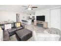 Open living room, kitchen, and breakfast bar area at 18406 W Sunbelt Dr, Surprise, AZ 85374