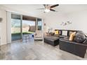 Living room with sliding glass doors and backyard access at 18406 W Sunbelt Dr, Surprise, AZ 85374