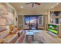 Relaxing living room with leather seating and scenic view at 24350 N Whispering Ridge Way # 49, Scottsdale, AZ 85255