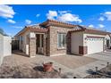 One-story home with stone accents and a two-car garage at 319 S 227Th Ct, Buckeye, AZ 85326