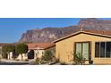 Neighborhood home featuring a red tile roof with views of the desert mountain range at 3301 S Goldfield Rd # 3038, Apache Junction, AZ 85119