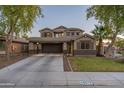 Two-story house with a large front yard and attached garage at 4275 E Amarillo Dr, San Tan Valley, AZ 85140