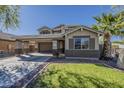 Inviting two-story home featuring desert landscaping, a two car garage, and covered parking at 4275 E Amarillo Dr, San Tan Valley, AZ 85140