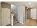 Modern staircase with gray carpeting and white railing at 5660 N 188Th Ln, Litchfield Park, AZ 85340