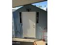 Exterior storage shed with white door and windows at 9501 E Broadway Rd # 107, Mesa, AZ 85208