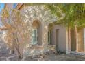 Front entrance with arched windows and stone accents at 9712 W Riverside Ave, Tolleson, AZ 85353