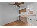 Small dining area adjacent to kitchen with wood floors at 100 N Vulture Mine Rd # 101, Wickenburg, AZ 85390