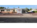 Front view of a single story home with a carport at 10620 W Clair Dr, Sun City, AZ 85351