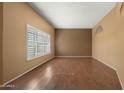 Spacious living room with hardwood floors and large windows at 11022 W Boswell Blvd, Sun City, AZ 85373