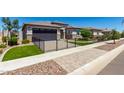 House exterior with a landscaped yard and walkway at 1176 E Ridgerock St, Casa Grande, AZ 85122