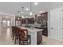 Modern kitchen with granite countertops and island at 1176 E Ridgerock St, Casa Grande, AZ 85122