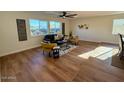 Bright living room with hardwood floors and modern furniture at 11808 S Half Moon Dr, Phoenix, AZ 85044