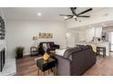 Bright living room with hardwood floors and a cozy fireplace at 11808 S Half Moon Dr, Phoenix, AZ 85044